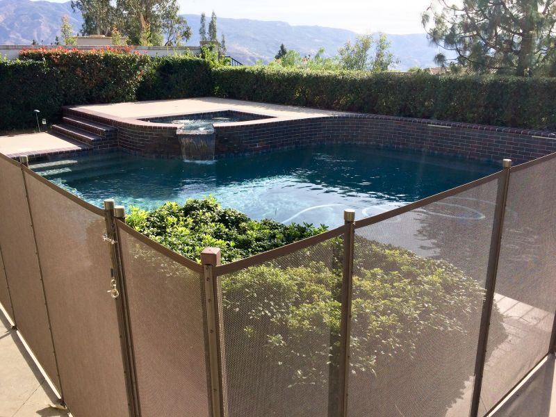 Mesh Fence Secured Around Pool